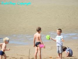 2017-65 Beach boy in very short speedo and his friends