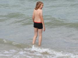 2017-244 Beach boy long hair in the sea