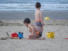 2018-046 2 little Boys playing with their toys on the beach