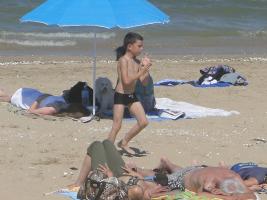 2011 - 54th album - Brown little beachboy in black swimsuit playing with his orange ball