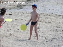 2017-55 Beachboy with cap playing racket
