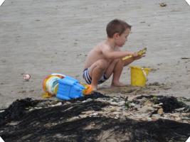 2017-228 Beach boy with yellow bucket and showel