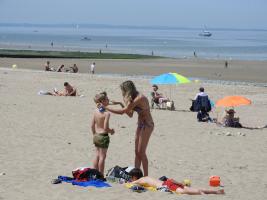 2018-035 Boy having solar cream on a beach