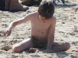 2018-010 beach boy playing with the sand