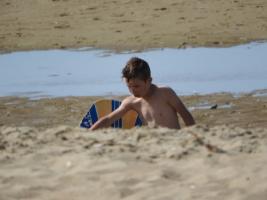 2018-031 Boy in a hole on the beach