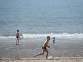 2018-047 Boys playing soccer on the beach