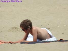 2017-146 The deaf beach boy lying on the sand