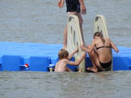 2017-189 Beach boys and girls onb a platform on the sea