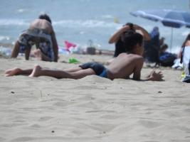 2018-045 Boy lying on the beach