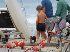 2020-052 Boy near a boat on the beach