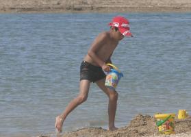 2011 - 55th album - The cute beach boy in black short with his red cap and 3 buckets