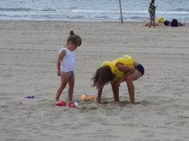 2017-292 Beach boy yellow life jacket and his sister