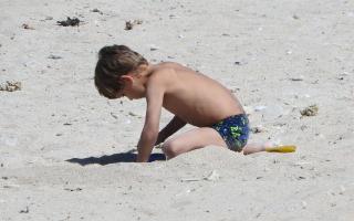 2020-025 Boy digging on the beach