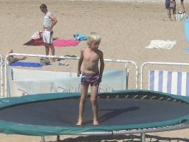 2011 - 50th album - Blond beach boy jumping and playing soccer