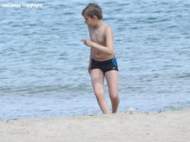 2016-076 Boy in black speedo on the beach
