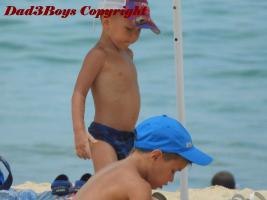 2017-22 Little brothers in speedo and caps on the beach