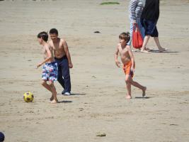 2018-072 Boys playing soccer on the beach