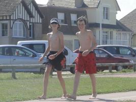 2011 - 46th album - 2 beach boys in swimsuit, walking along the beach