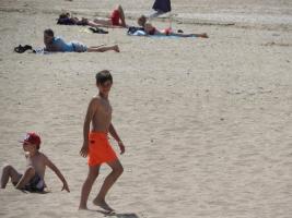 2018-030 boy orange short is back on the beach
