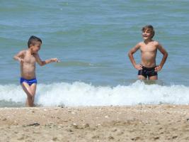 20186079 Boys 2 good friends playing in the sea