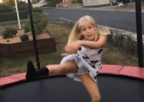 Blonde cutie jumping on her trampoline in her dress