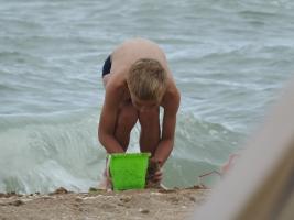 2017-256 Beach boy in speedo with his green bucket